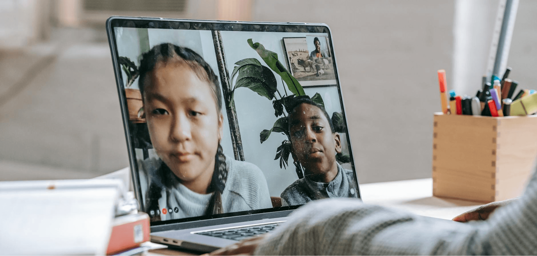 Two students on a video call during an online tutoring session